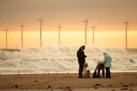 Offshore windfarm near Seaton Carew beach, County Durham, UK. Credit: Islandstock / Alamy Stock Photo. PYWFWF