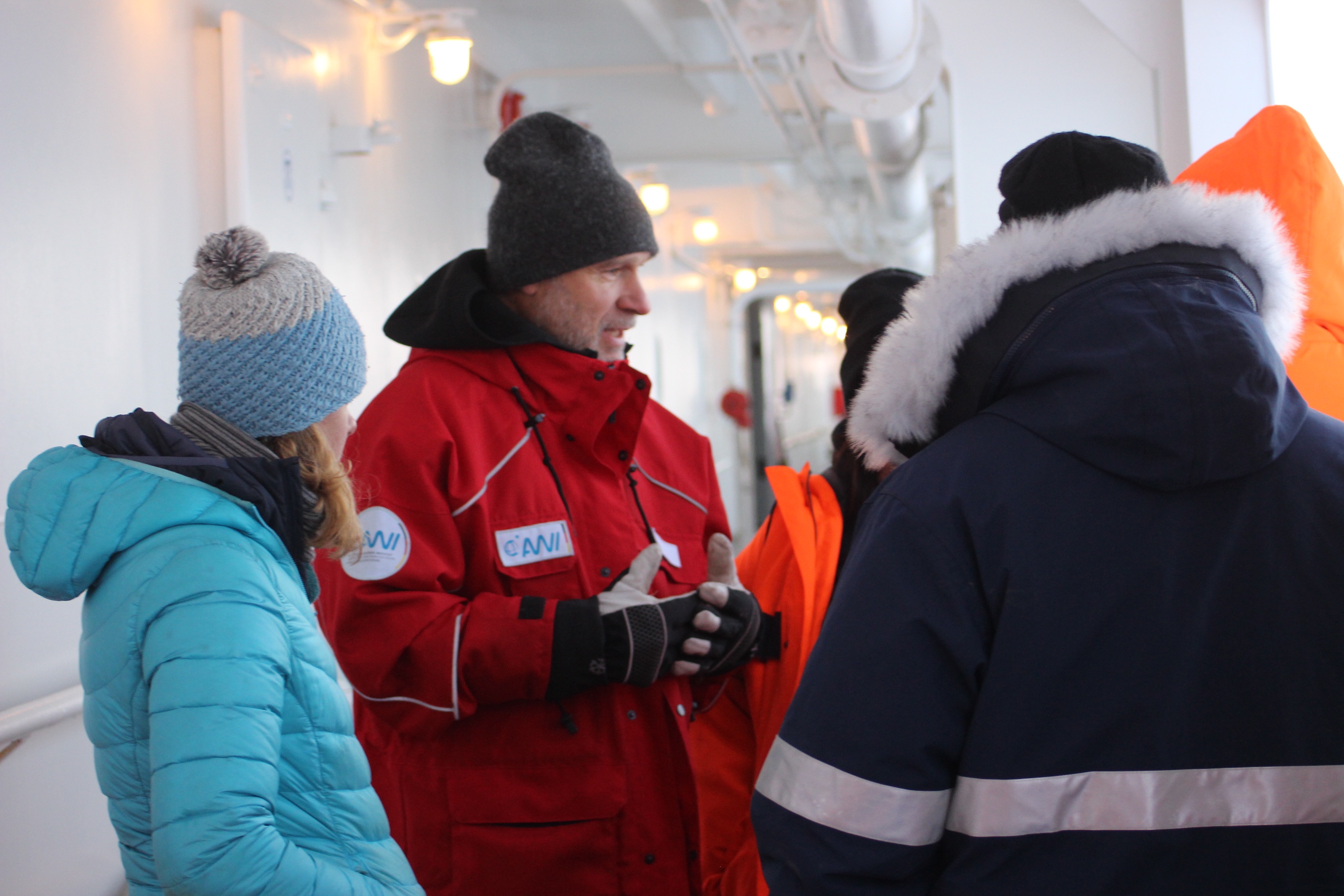 Prof Jari Haapala speaks with scientists on the deck of the Akademik Fedorov. 