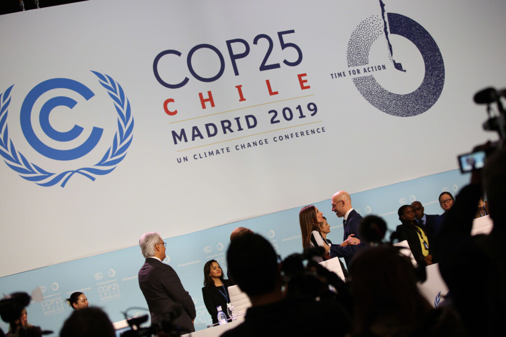 Michał Kurtyka, COP 24 President, Poland, welcomes Carolina Schmidt, COP 25 President, Chile, to the podium to take over the presidency.