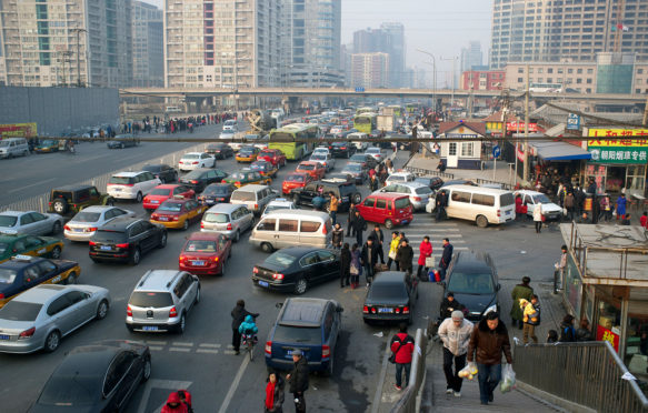 Traffic in Beijing, China. Credit: Lou-Foto / Alamy Stock Photo. CFKCFE
