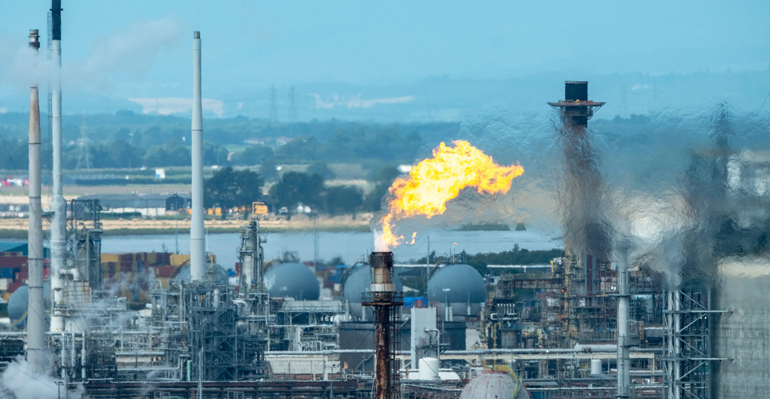 Gas flare stack burning at the Grangemouth oil refinery, Scotland Credit: Ian Rutherford / Alamy Stock Photo