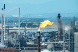 Gas flare stack burning at the Grangemouth oil refinery, Scotland Credit: Ian Rutherford / Alamy Stock Photo