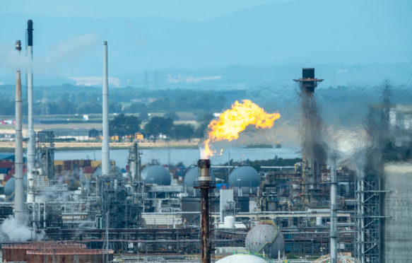 Gas flare stack burning at the Grangemouth oil refinery, Scotland Credit: Ian Rutherford / Alamy Stock Photo