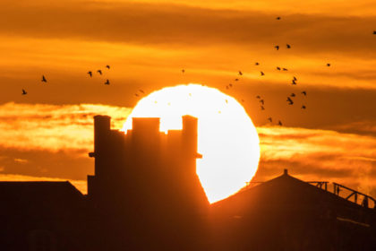 Unseasonably warm weather as the morning sun rises over the historic landmarks along the promenade in Southport on Merseyside, UK. 2 January 2020. Credit: KeyWorded / Alamy Stock Photo