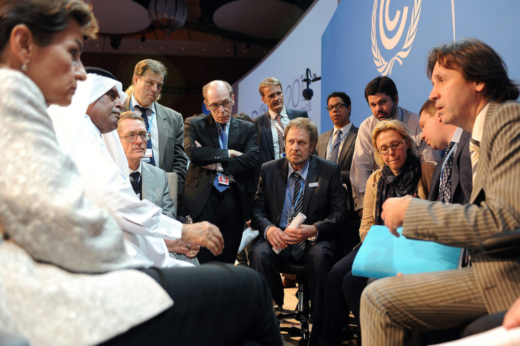 COP President consults with delegates from the Russian Federation, Ukraine and Belarus before the closing plenary at COP18 in Doha. November 2012. Credit: IISD/ENB 