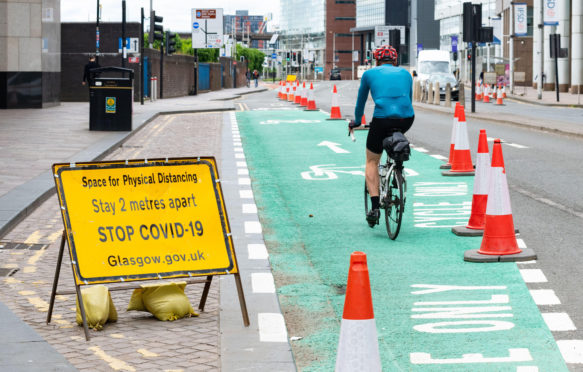 Cyclists in Glasgow making use of quiet streets and existing and new cycle lanes.
