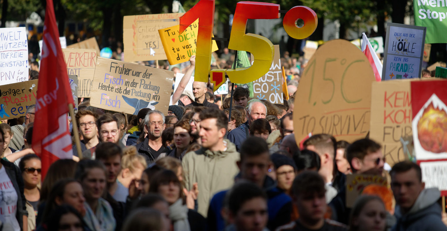 Demonstrators holding up a large 1.5 at Friday for Future protest