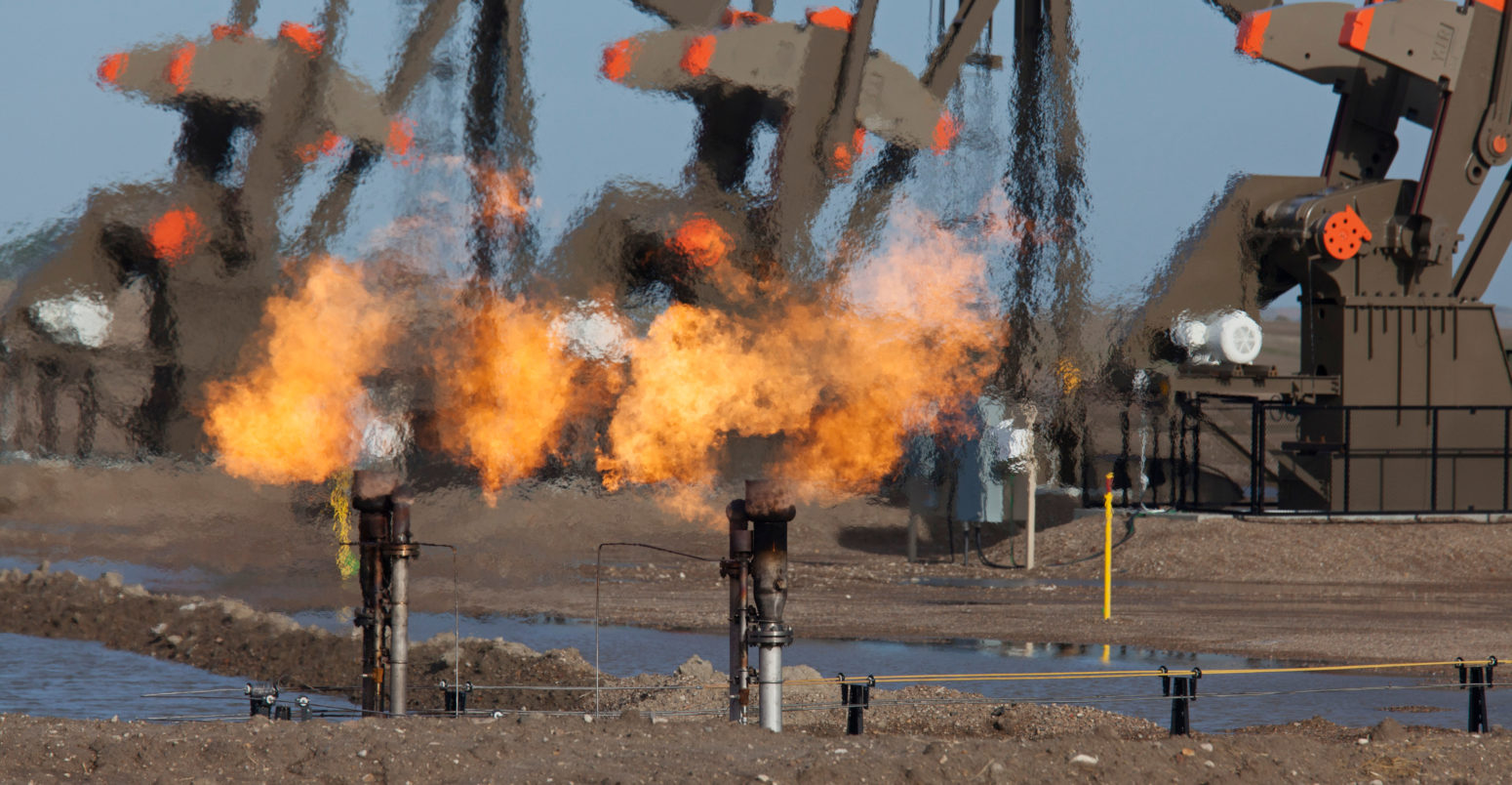 Natural gas is flared off as oil is pumped in the Bakken shale formation. Credit: Jim West / Alamy Stock Photo E1MT0N