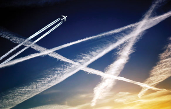 Aeroplane and aircraft jet trails in the sky.
