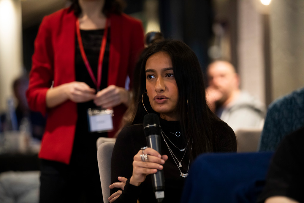 Attendees speak at the Climate Assembly. 