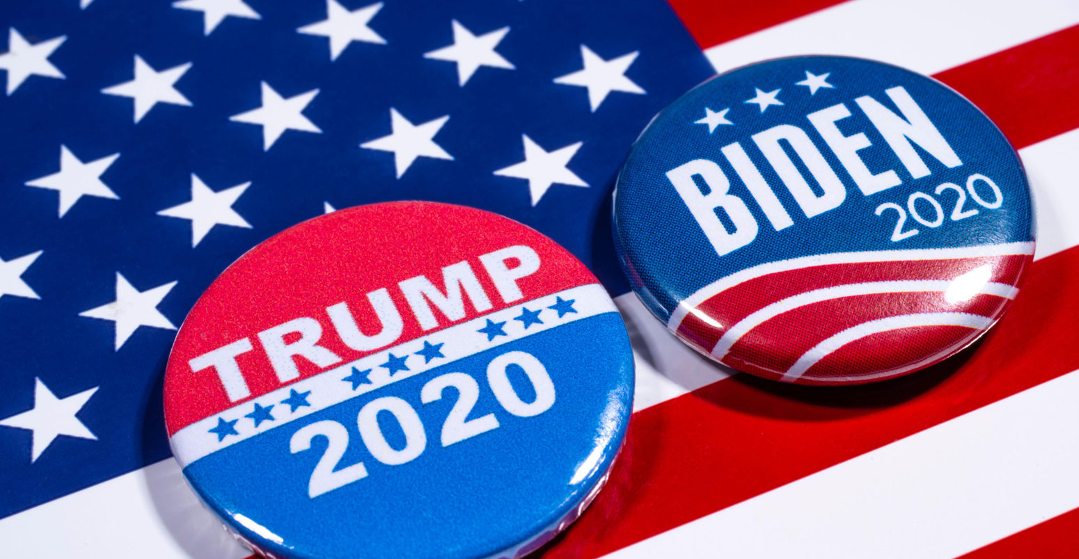 Donald Trump and Joe Biden pin badges, pictured of the USA flag.