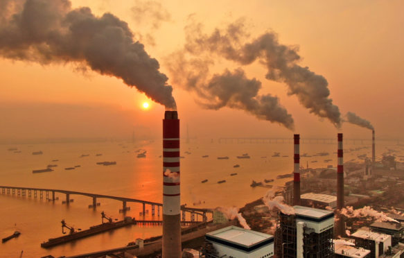 Smoke is discharged from chimneys at a coal-fired power plant in east China's Jiangsu province.