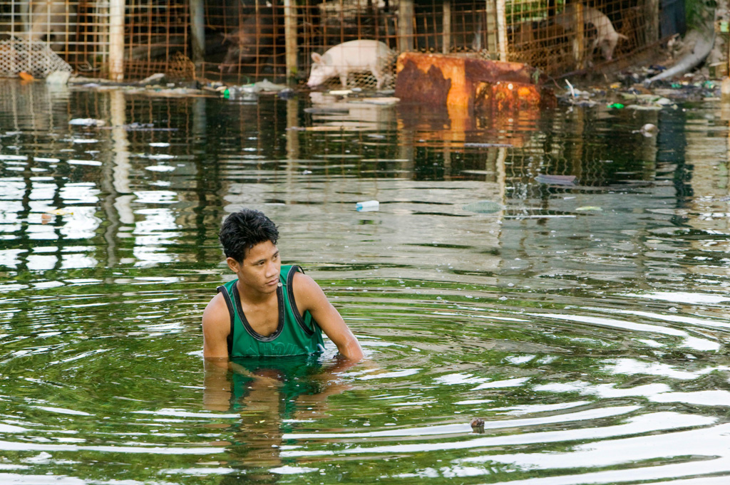 Man-in-water-as-low-lying-island-Funafuti-Atoll-is-flooded-by-sea-water