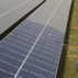 Workers clean photovoltaic panels inside a solar power plant in Gujarat, India.