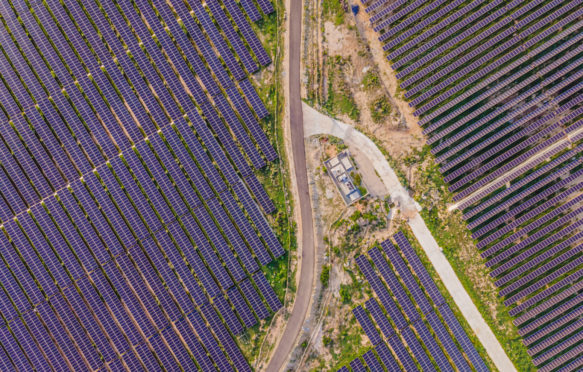 Aerial view of solar panels in a solar farm in Thailand.