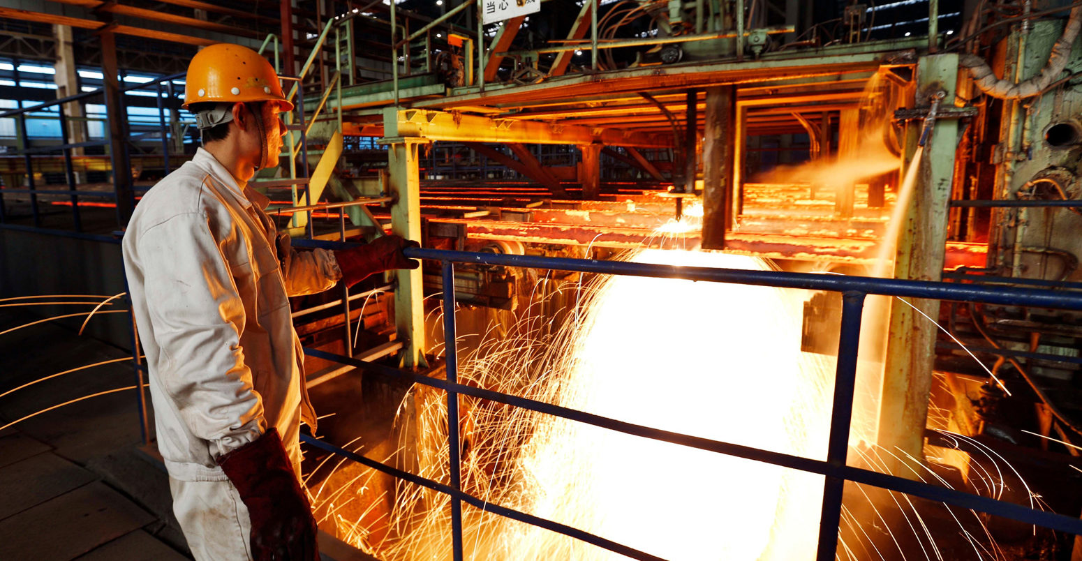 A-chinese-worker-surveys-the-production-of-steel-at-a-steel-plant-in-Lianyungang-east-Chinas-Jiangsu-province