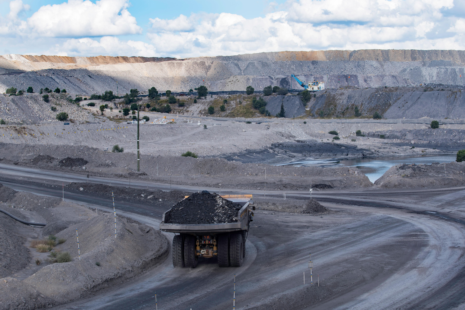 A-haul-truck-carries-a-load-of-coal-through-the-Mount-Thorley-Warkworth-coal-mine-in-the-NSW,-Australia