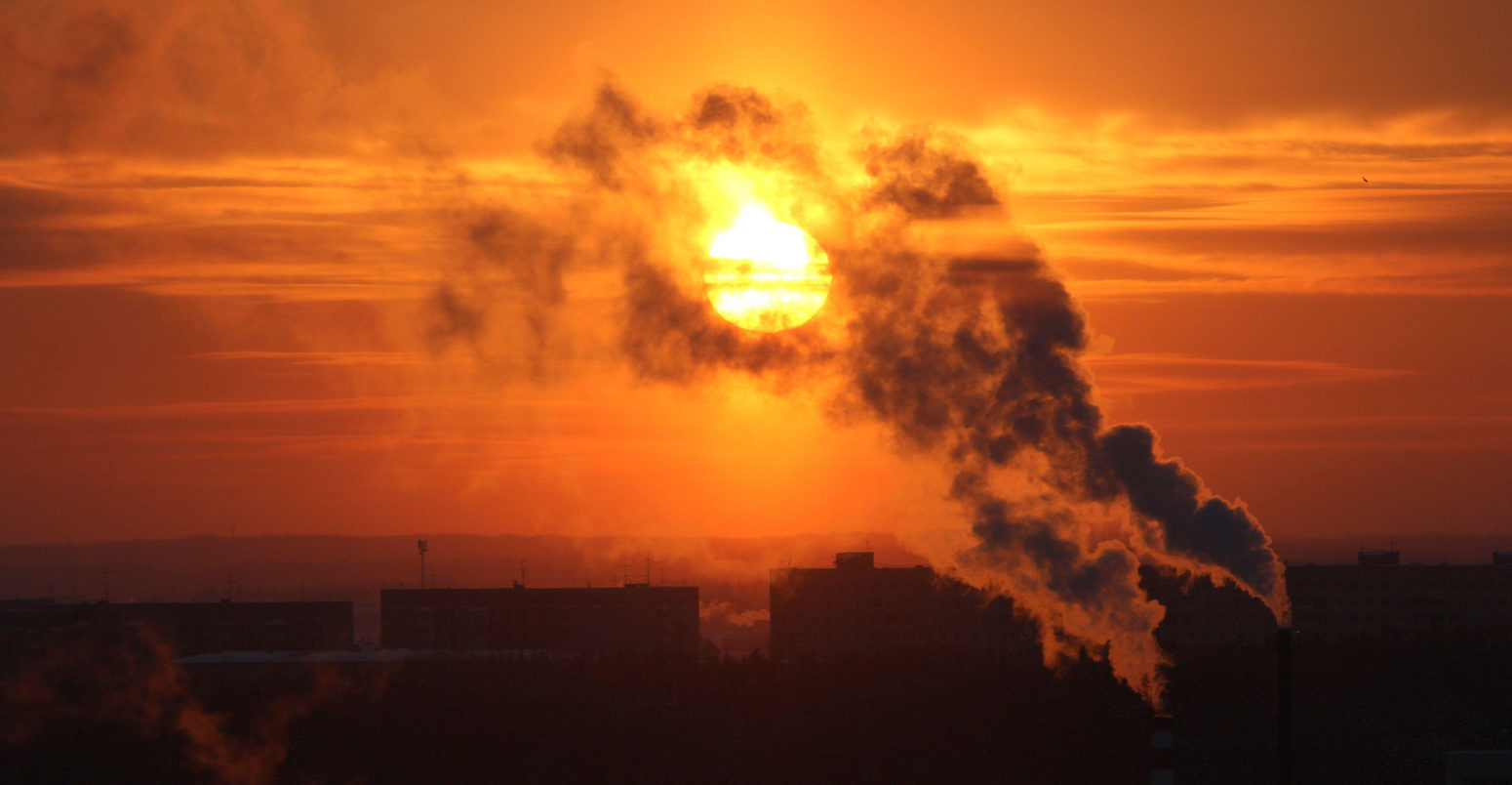 Red-sun-at-sunset-shrouded-in-smoke-from-plant-chimneys-in-Russia