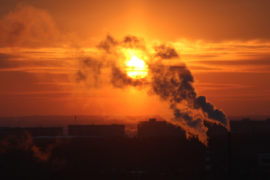 Red-sun-at-sunset-shrouded-in-smoke-from-plant-chimneys-in-Russia