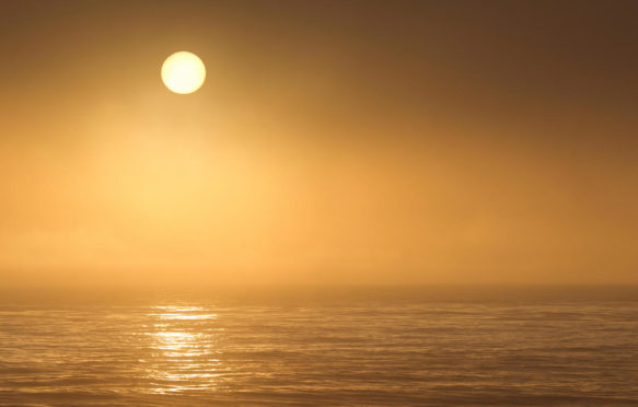 Sun setting over Pacific ocean