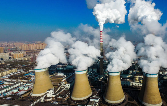 Smoke is discharged from chimneys at a coal-fired power plant in Datong city, Shanxi province