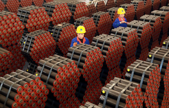 Factory workers in Tongcheng, China, on 17 November 2020. Credit: Costfoto / Alamy Stock Photo.