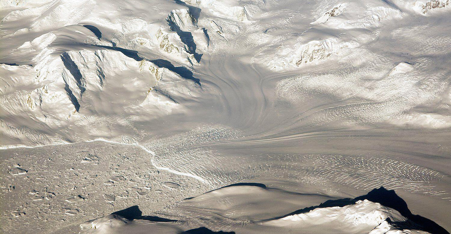 Glaciers-and-mountains-in-the-evening-sun-are-seen-on-an-Operation-IceBridge-research-flight,-returning-from-West-Antarctica-edited