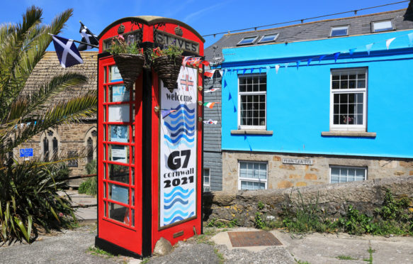 Red phone box in St Ives, decorated to welcome the G7 summit to Cornwall