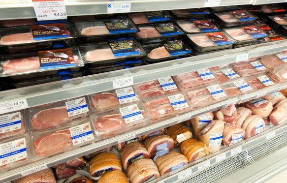 Bacon and pork on shelves in a UK supermarket