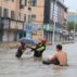 Firefighters help citizens with their vehicles and safety as Typhoon In-fa brings heavy rains and flooding in Ningbo City_2GA6GHR