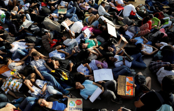 People stage a die-in during a Fridays for Future march in New Delhi