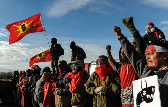 Protesters block a highway during a protest in Mandan against plans to pass the Dakota Access pipeline near the Standing Rock Indian Reservation_2CMRP74