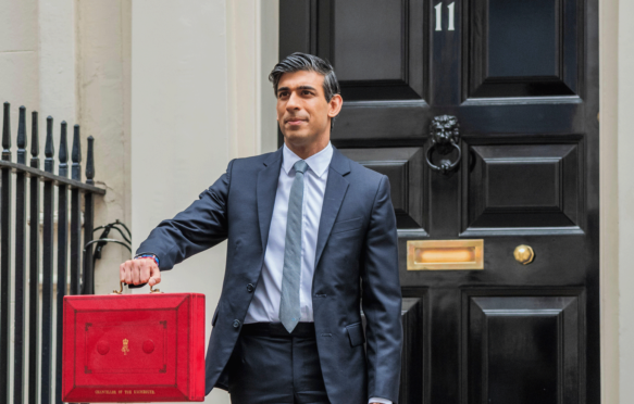 Rishi Sunak, Chancellor of the Exchequer, leaves No 11 Downing Street and heads to Parliament to give his Budget speech