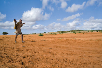 A man walking in the dried-out field in Andranosira