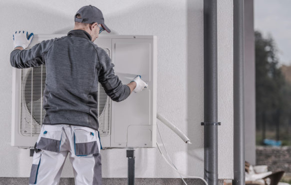 Heat pump being replaced by a heating technician