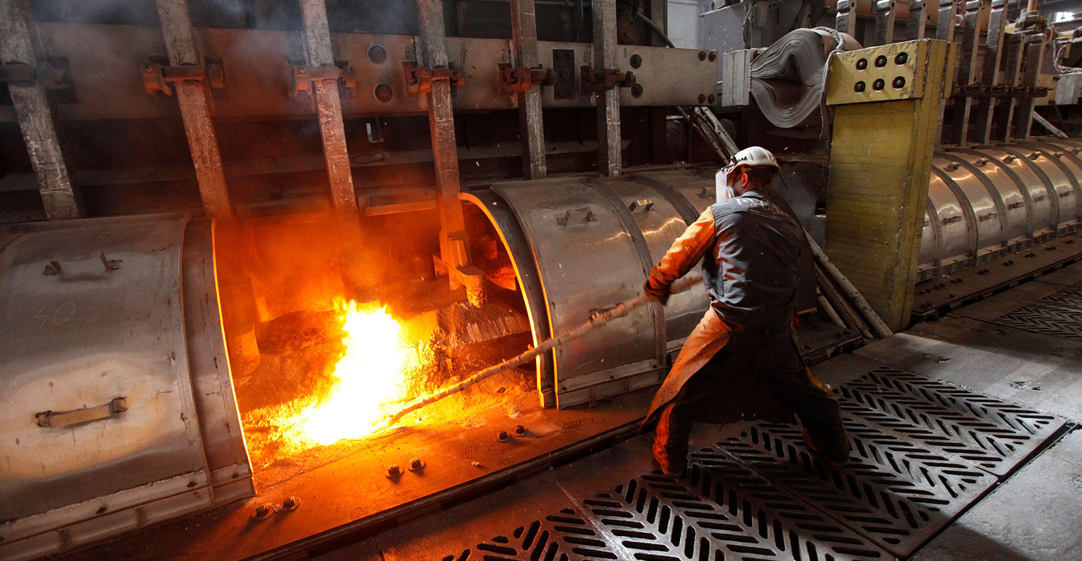 A worker operates an electrolysis furnace