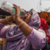A woman drinks water during a hot day in New Delhi, April 29, 2022