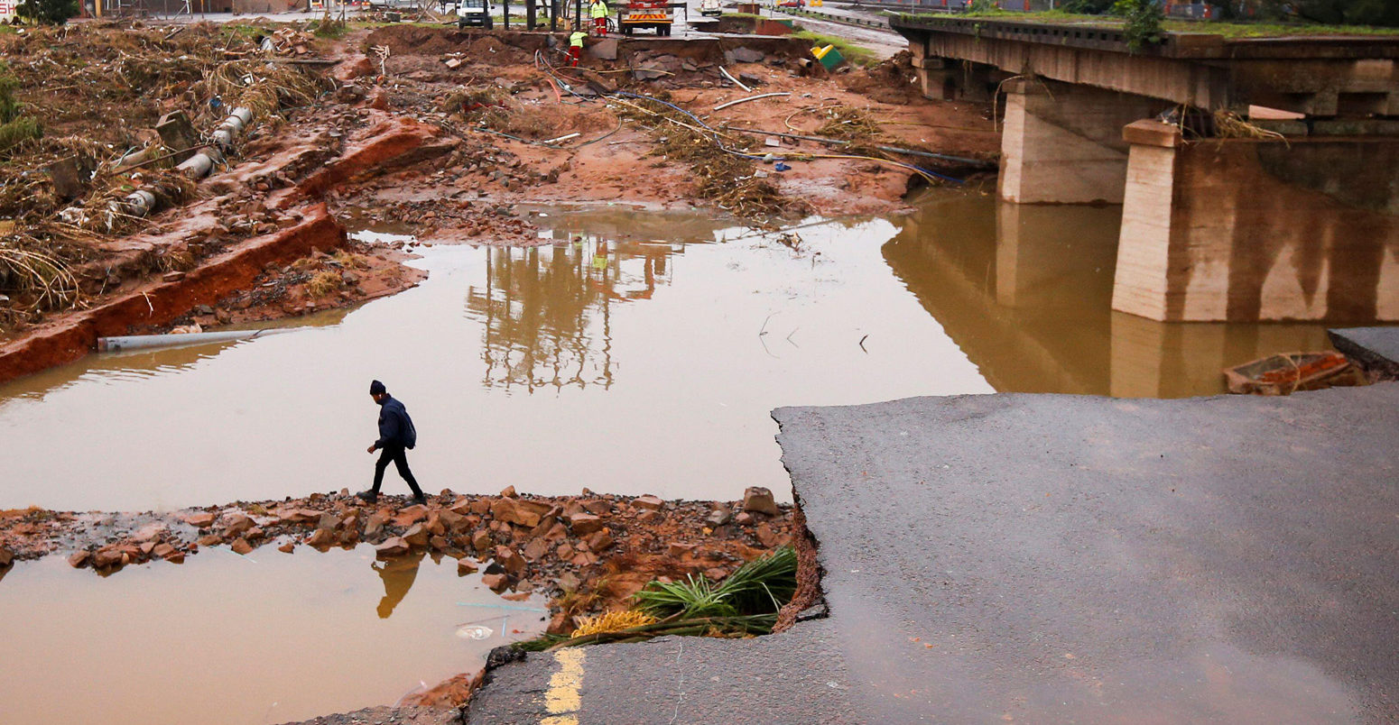 A damaged bridge caused by flooding near Durban, South Africa, 16 April 2022. Credit: Reuters / Alamy Stock Photo. 2J4KM20