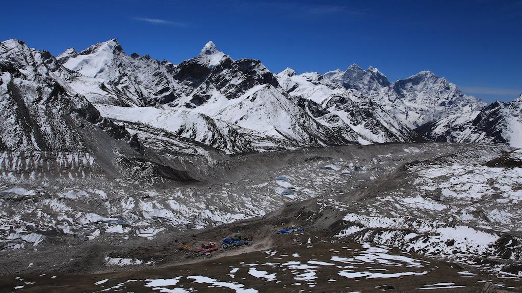 Mt Everest, Khumbu glacier icefall and Everest base camp in the distance.