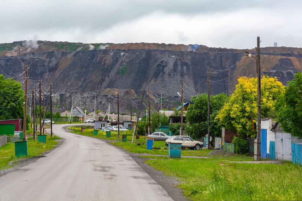 Starobachatsky village near the coal mine dump, Kemerovo region-Kuzbass, Russia.