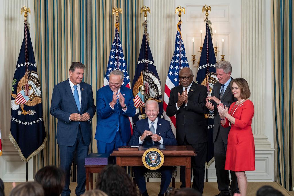 Joe Biden signs the Inflation Reduction Act into law during a ceremony in the State Dining Room of the White House August 16 2022 in Washington, DC. Image ID: 2JPD58T.