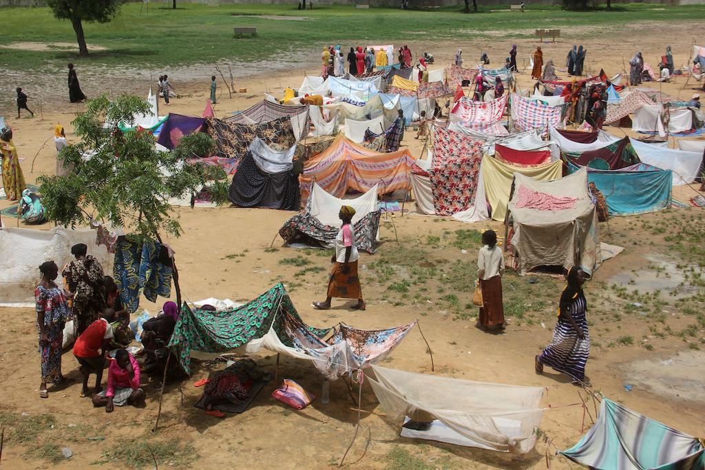 Flood victims set up makeshift shelters in a schoolyard where they take refuge after heavy rains in Ndjamena, Chad, 2 September 2022.