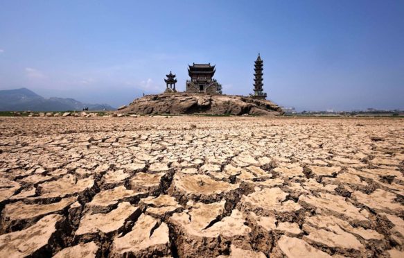 Pagodas on Luoxingdun Island that usually remain partially submerged under the water of Poyang Lake Lushan, Jiangxi province, China, 24 August 2022.