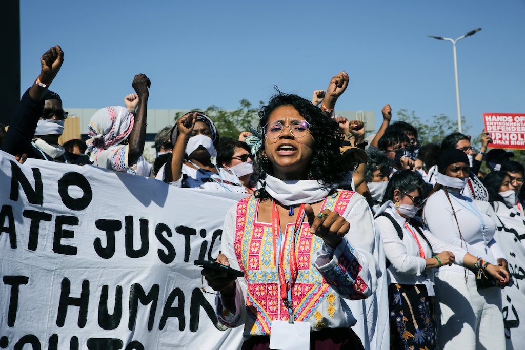 Protesters at COP27 calling for action for human rights and women environmental defenders