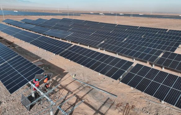 Installation of photovoltaic panels at the solar power generation project in Zhangye, China.