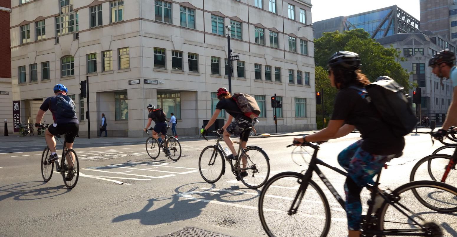 Cyclists crossing Lower Thames Street in London, UK, 2021.