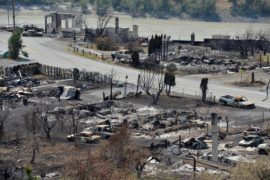 The charred remnants of buildings destroyed by a wildfire in Lytton, Canada.