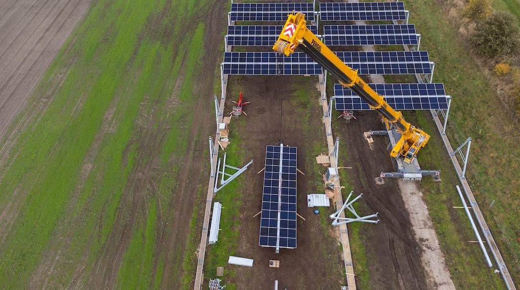 A crane is used to hoke an agricultural photovoltaic system in Lüchow, Germany on November 3, 2021.