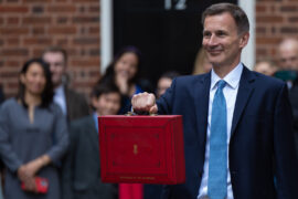 The Chancellor of the Exchequer Jeremy Hunt, accompanied by his ministerial team and watched by his wife and children, leaves 11 Downing Street on his way to deliver the budget on March 15, 2023.
