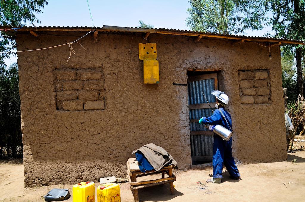 A health worker sprays pesticide to prevent mosquitos that carry malaria, as part of a USAID program in Oromia, Ethiopia.